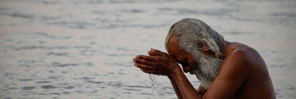 woman in black bikini bottom on water during daytime